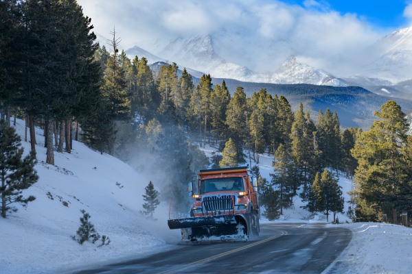 Snow removal trucks operating in rural area.